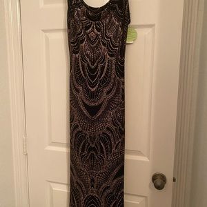 New with tag…. Black with gold design floor  length evening gown